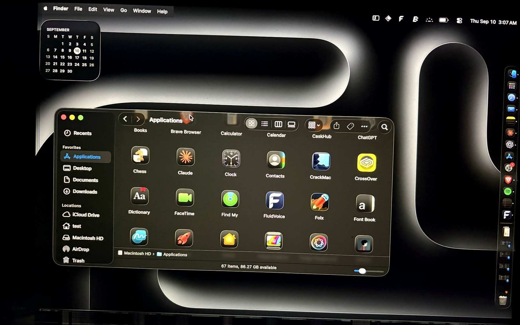 The same MacBook Air running CrackMac: the dead strip is blacked out and every window and the menu bar sit inside the working area.